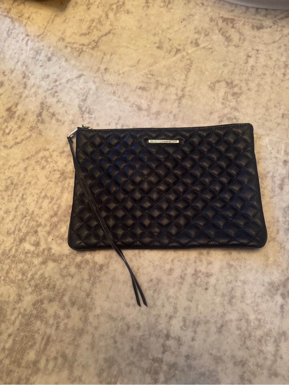 black quilted leather pouch with a gold-tone by Rebecca Minkoff